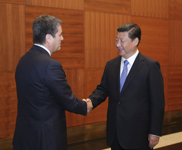 Chinese president urges bigger role of WTO