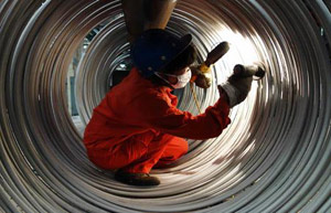 China sees record steel output, price at 11-year low