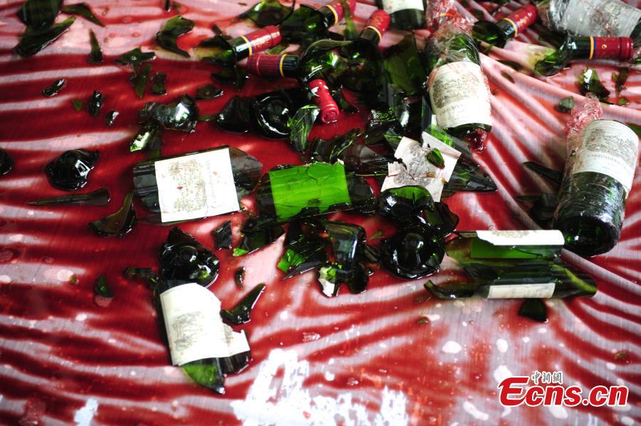 Wine dealer smashes fake Chateau Lafite in Shenzhen
