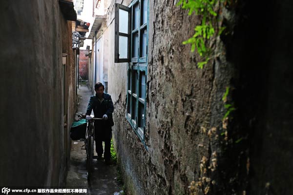 Last of the tribe: Postman on bicycle