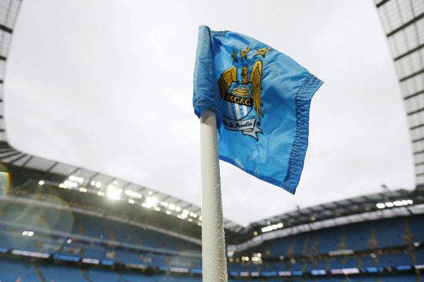 Chinese consortium buys stake in owner of Manchester City