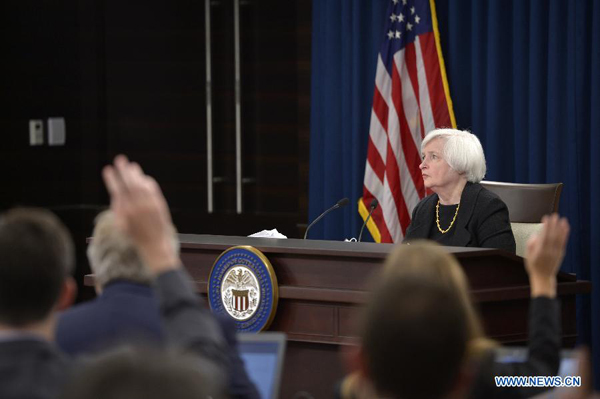 Fed keeps interest rates steady, closely watching global markets