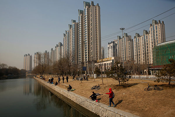 Banks in Beijing raise mortgage rates further to cool property market