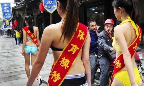 Bikini girls stroll along Chengdu street