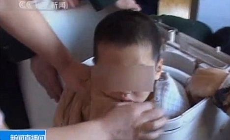 Chinese toddler freed from washing machine
