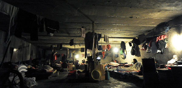Migrant workers make their home under overpass