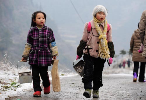 Pupils take up books, pens, and hand-stoves