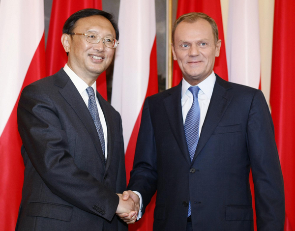 China's FM to discuss developing ties with Poland