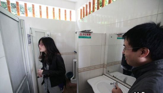 Women 'occupy' men's toilets in equality protest