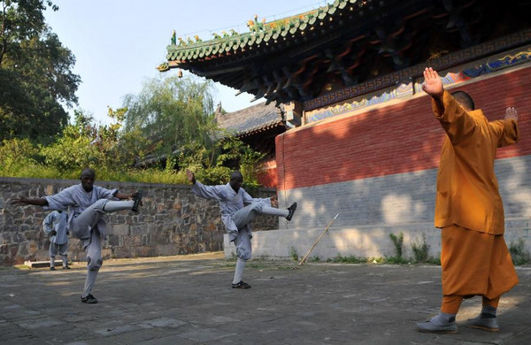 African apprentices practise kung fu at Shaolin Temple