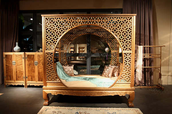 A latticed boudoir bed flaunts intricately repetitive flower patterns made using mortise-and-tenon joints. A fascination with wood