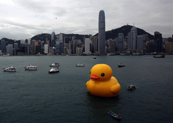 Rubber Duck by Dutch conceptual artist Florentijn Hofman floats at Hong Kong's Victoria Harbour, with the island skyline looms at the background, on May 2, 2013. Weekly Photos: April 29 - May 5