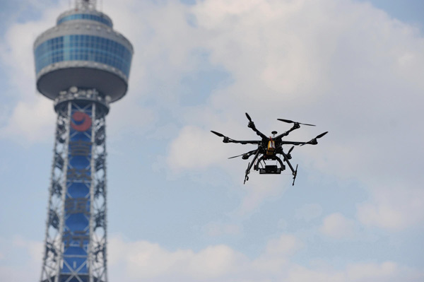 An air vehicle flies while taking aerial photos in Changchun, Northeast China's Jilin province, on May 3, 2013. Weekly Photos: April 29 - May 5