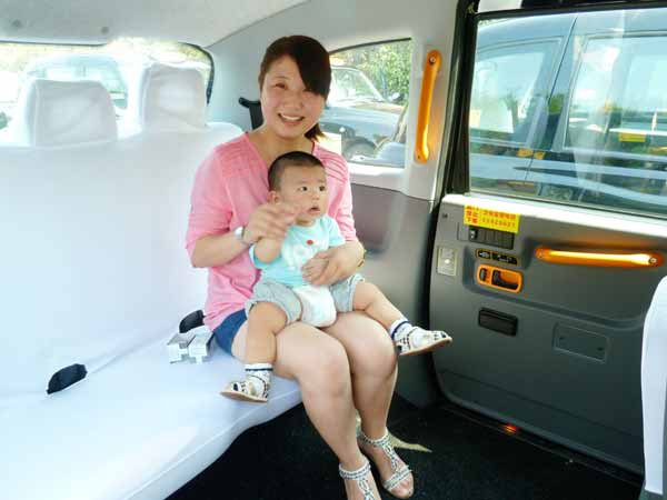 Classic British taxi cabs on road in E China