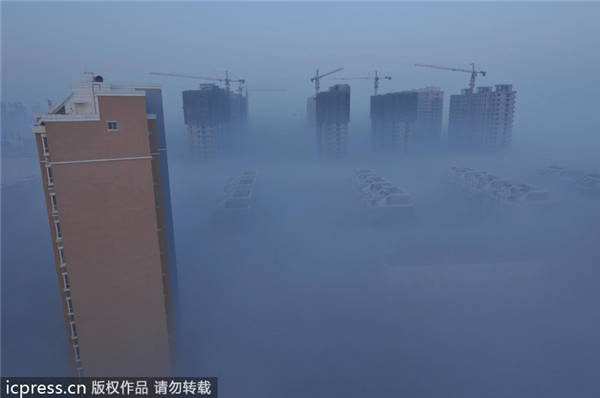 Fresh smog shrouds east, north China