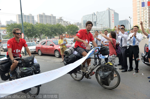 Duo ends pedal-powered journey from Paris to Beijing