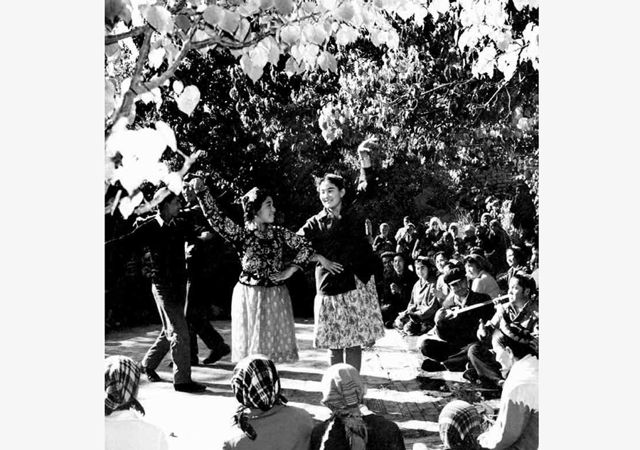 a photo of uygur dance, taken by ru suichu in 1980.