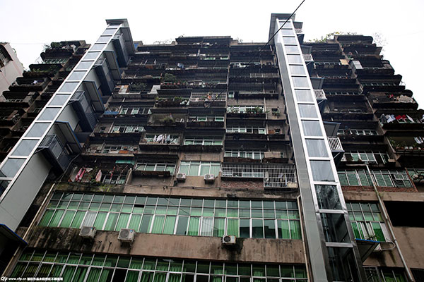 Residents pool money to buy elevators for old building