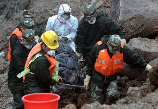 34 landslide bodies found as more storms expected