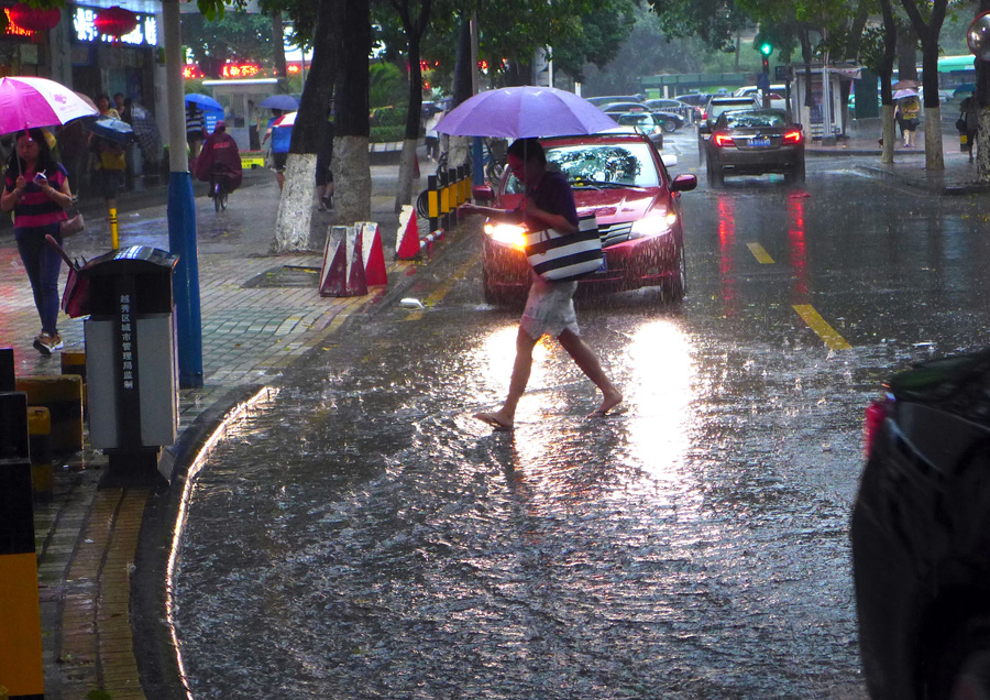 Heavy rains flood streets in Guangzhou