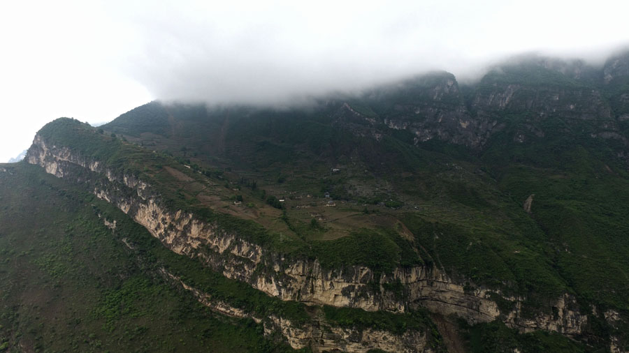 Children scale 800-meter cliff on way to school