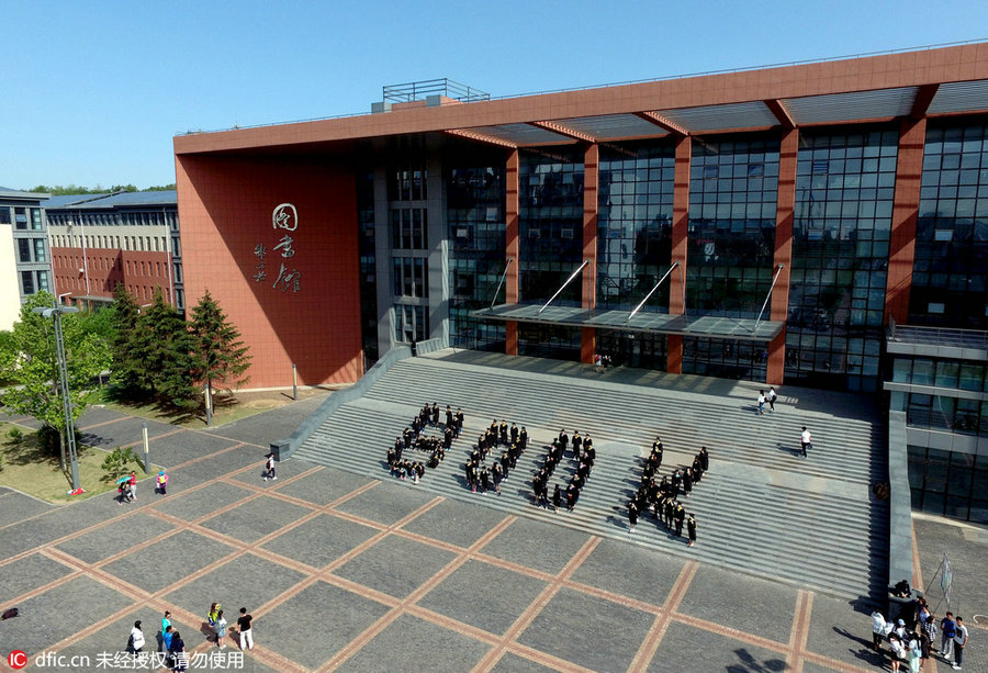 Students pose for special group photos to mark graduation