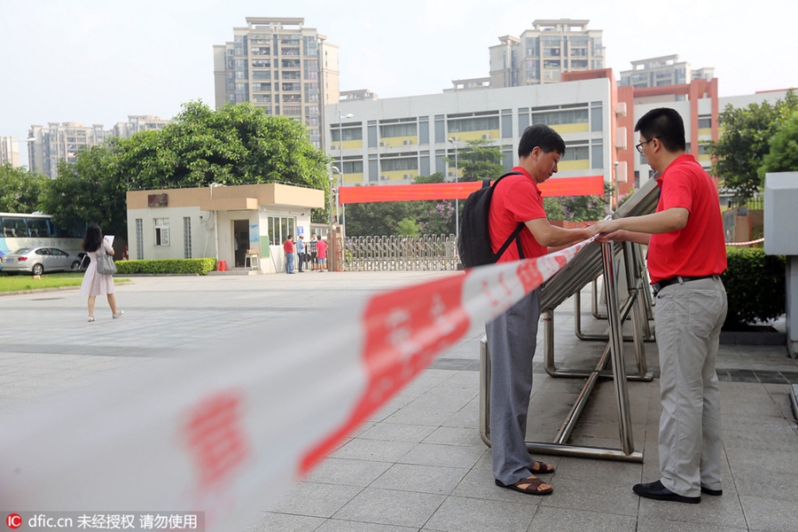 Hugs, anxious parents, high-tech security: China's college entrance exam starts