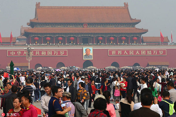 tourists gather in tiananmen square in beijing, oct 1, 2016.