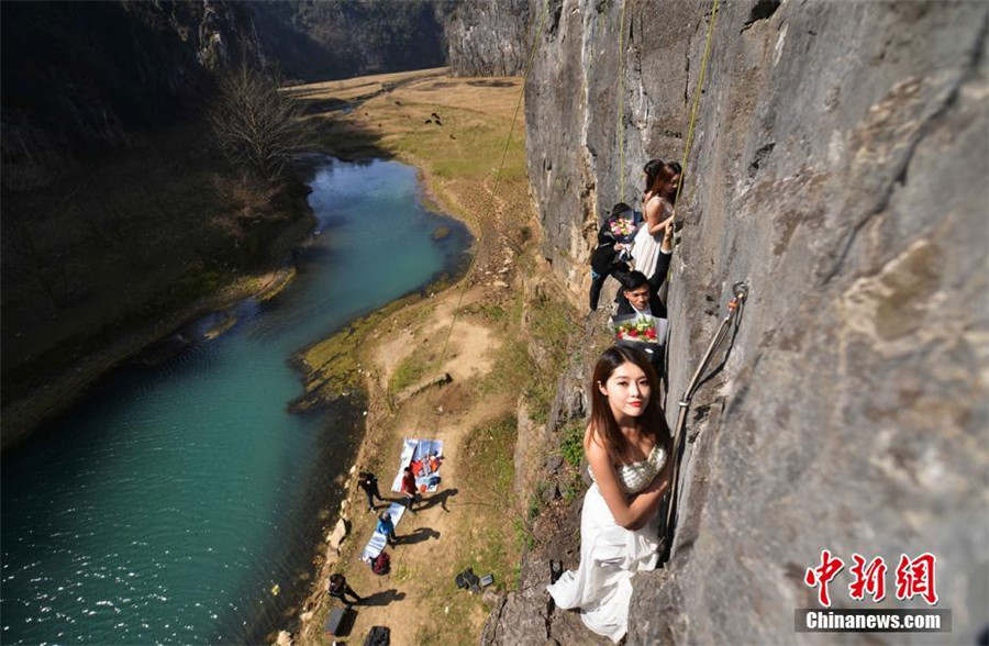 Taking love to new heights with special cliffside wedding photo
