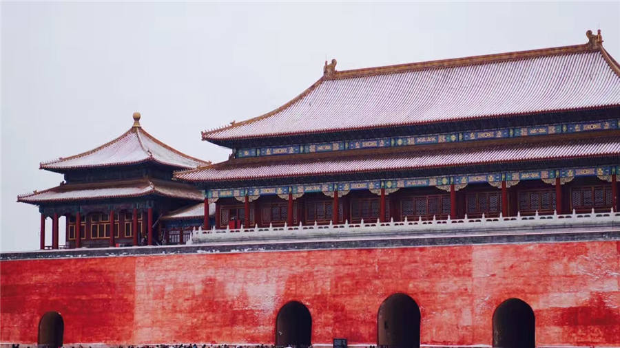 Spring snow blankets Forbidden City