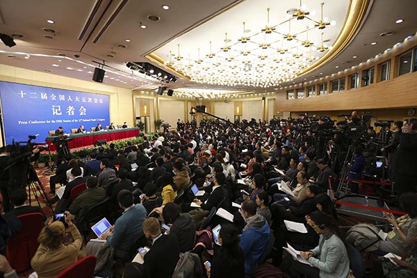 China's top economic planner holds press conference