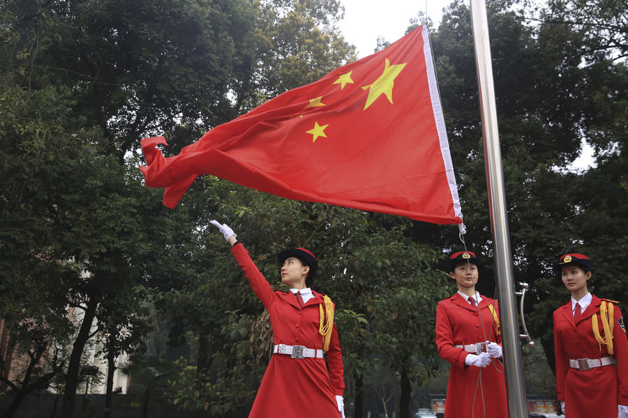 Female college students form flag-raising team