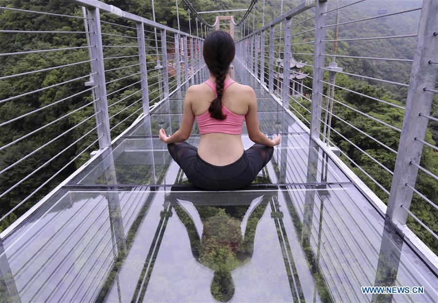 Yoga practiced on suspension bridge
