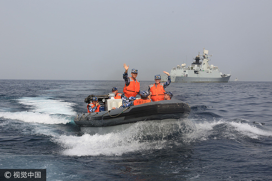 Navy sailors tie knot in middle of sea