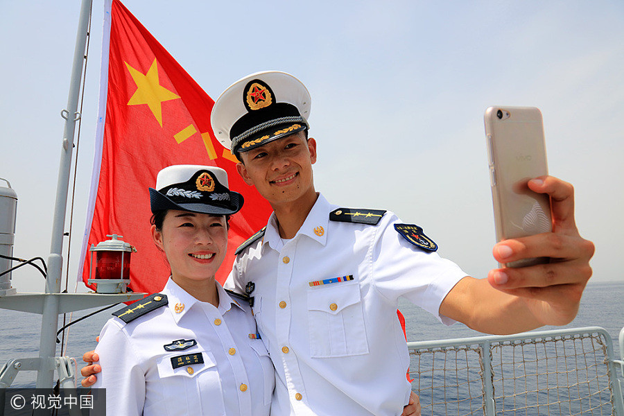 Navy sailors tie knot in middle of sea