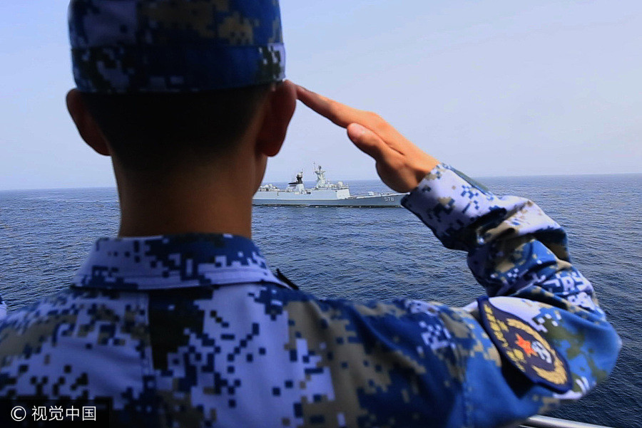 Navy sailors tie knot in middle of sea