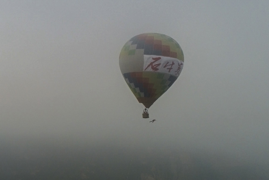 Chinese female BASE jumper leaps off hot air balloon