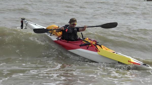 Man kayaks along China's coastline