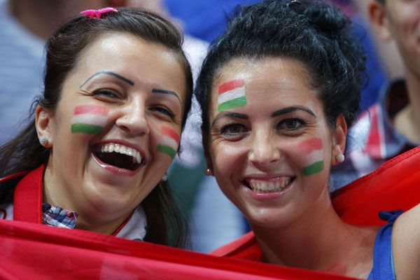 Painted faces of Olympic fans