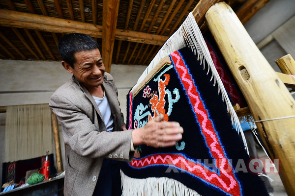 Bearer of Tibetan carpet in Qinghai
