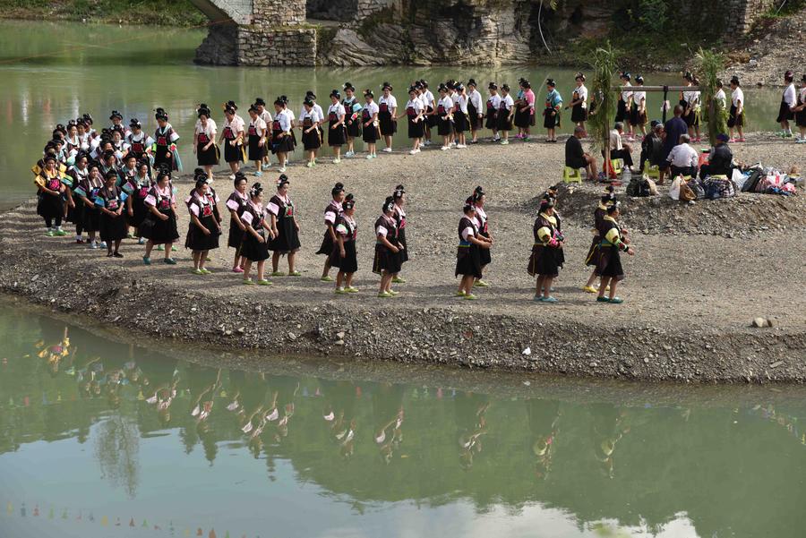 Miao people dance to celebrate 'Chixin Festival' in SW China's Guizhou