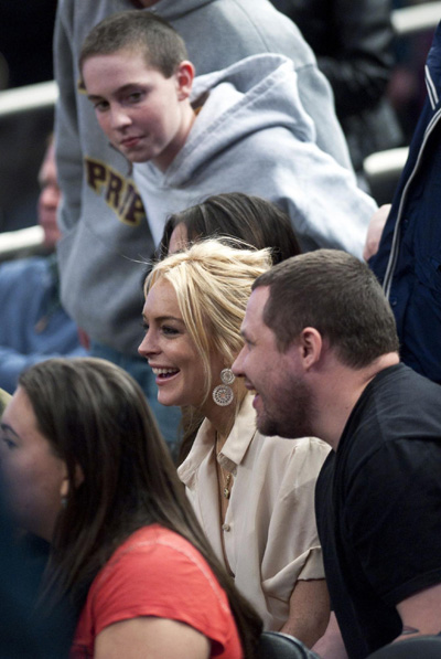 Lindsay Lohan watches NBA basketball game