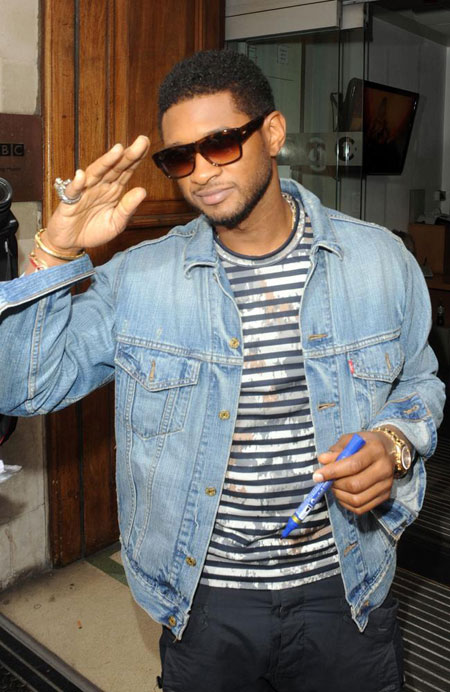 Usher 'standing strong' following stepson's death