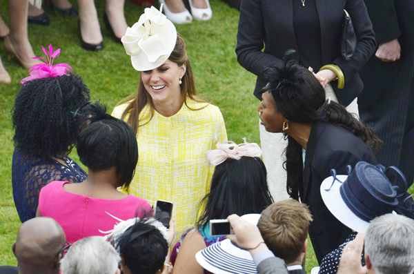 Pregnant Catherine attends garden party