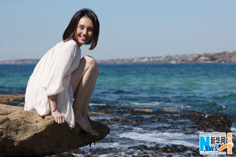 Actress Yuan Quan poses on beach