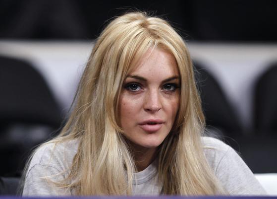 Lindsay Lohan attends the NBA basketball game