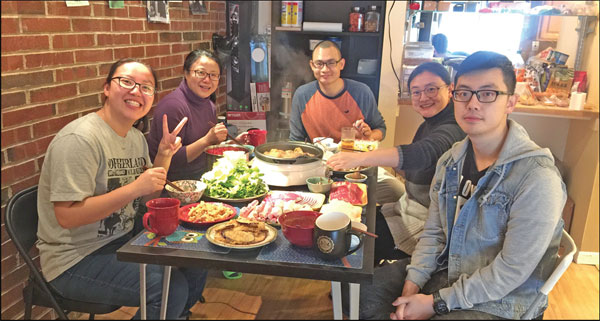 zhang le second from right enjoys a meal with her family and friends at