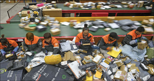 workers deal with packages at a courier company in yinchuan capital of