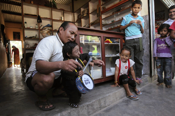 Nepal teen stands tall as world's shortest man