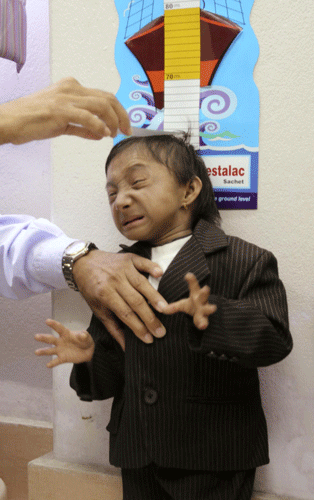 Nepal teen stands tall as world's shortest man